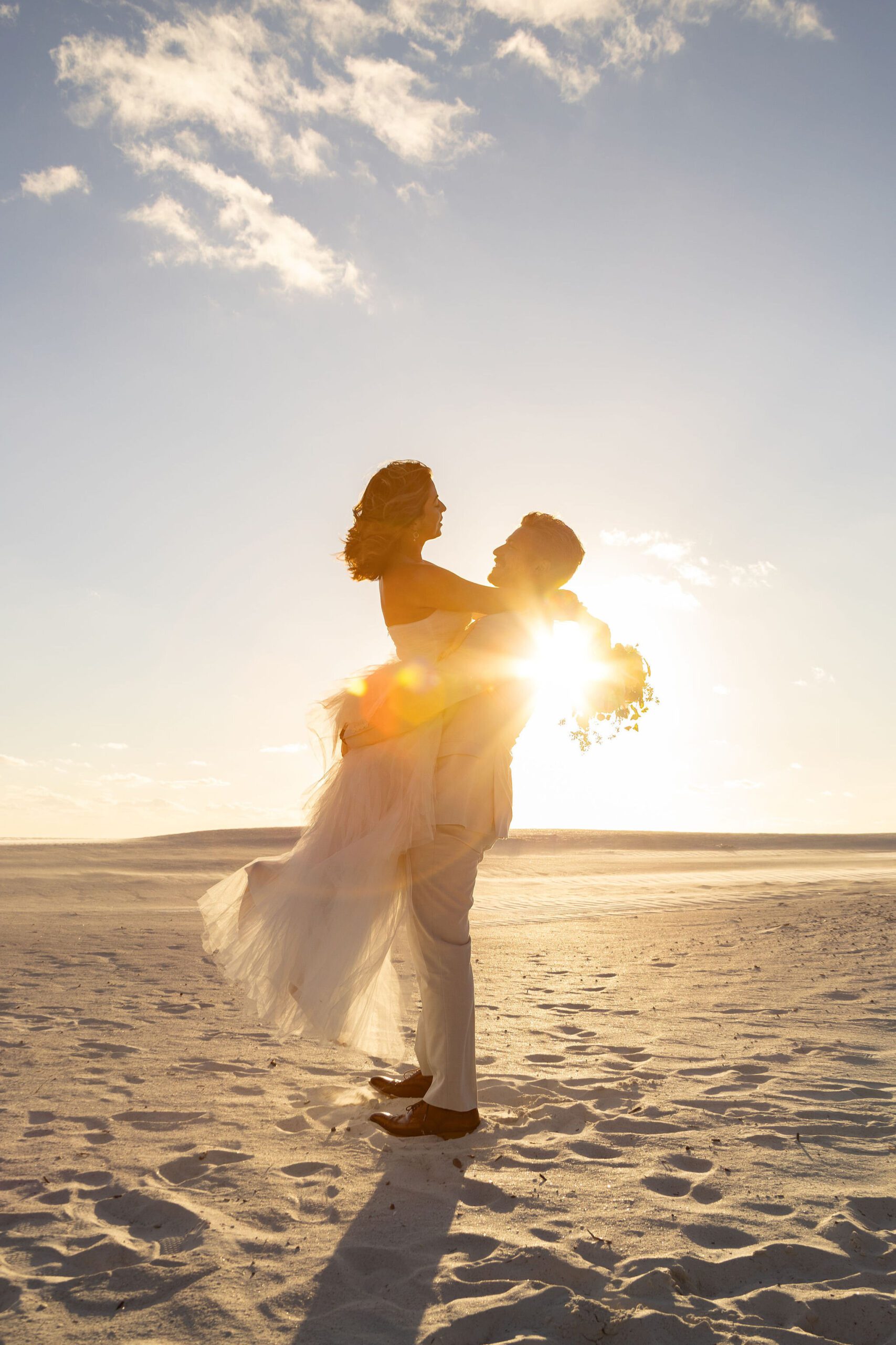 Couple eloping during sunset on the beach in Florida