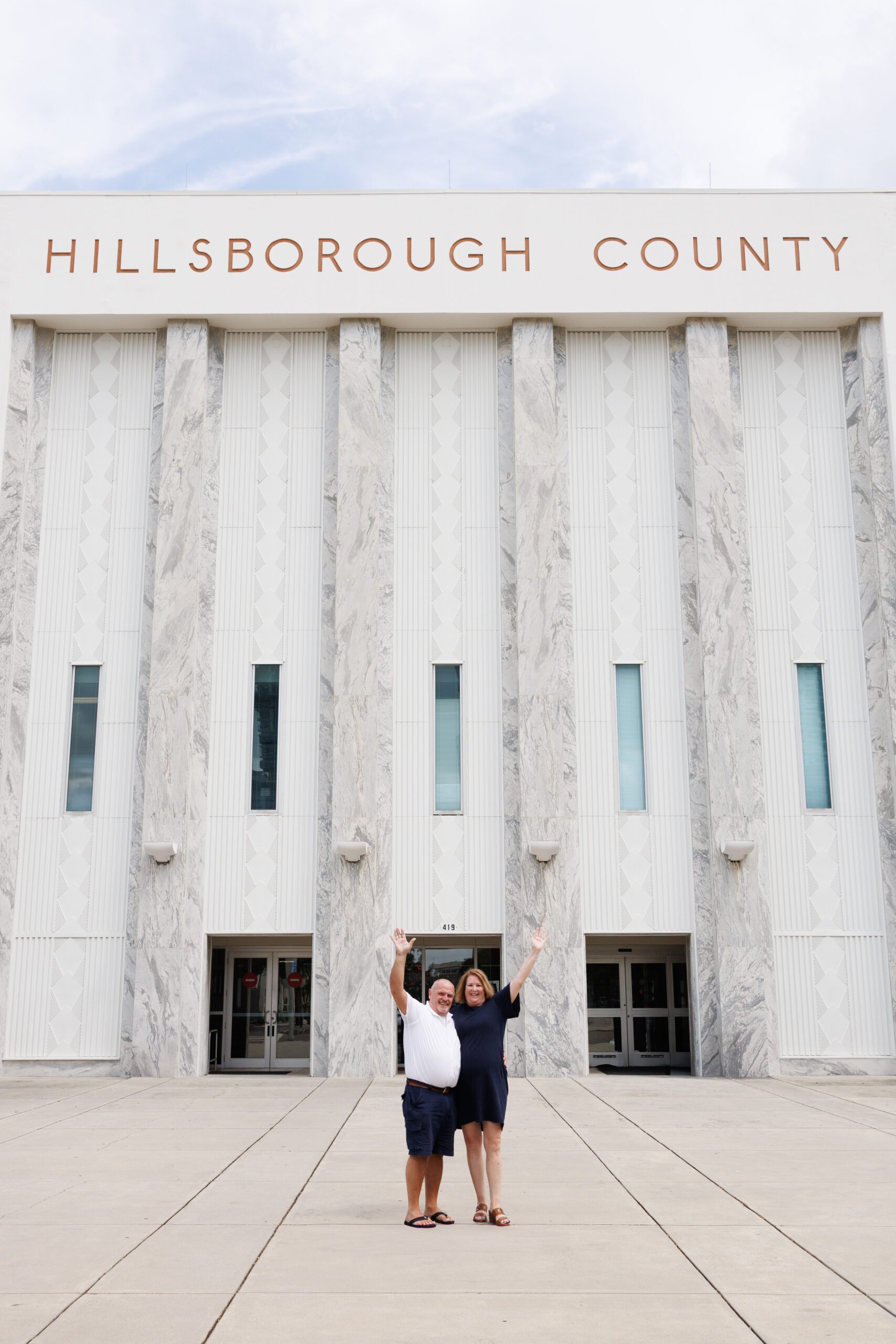 Couple eloping in front of the Hillsborough County Courthouse Florida being one of the best places to elope in the US