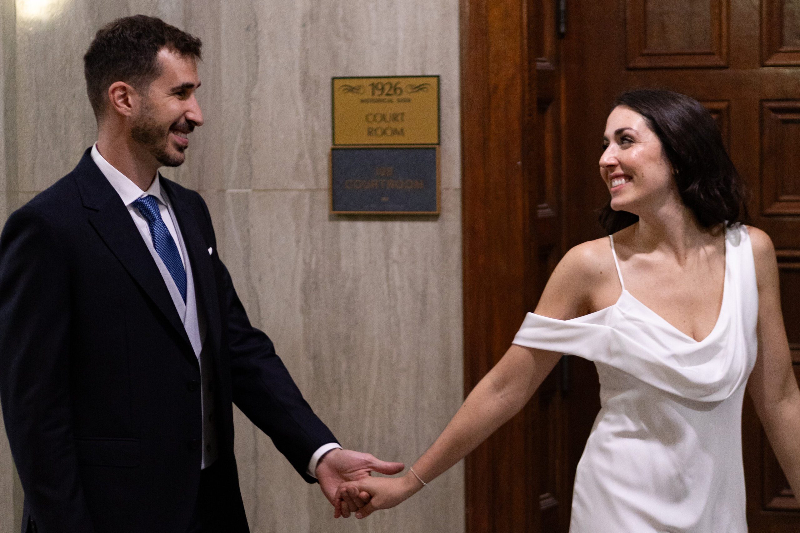 Bride leading groom at the sarasota courthouse
