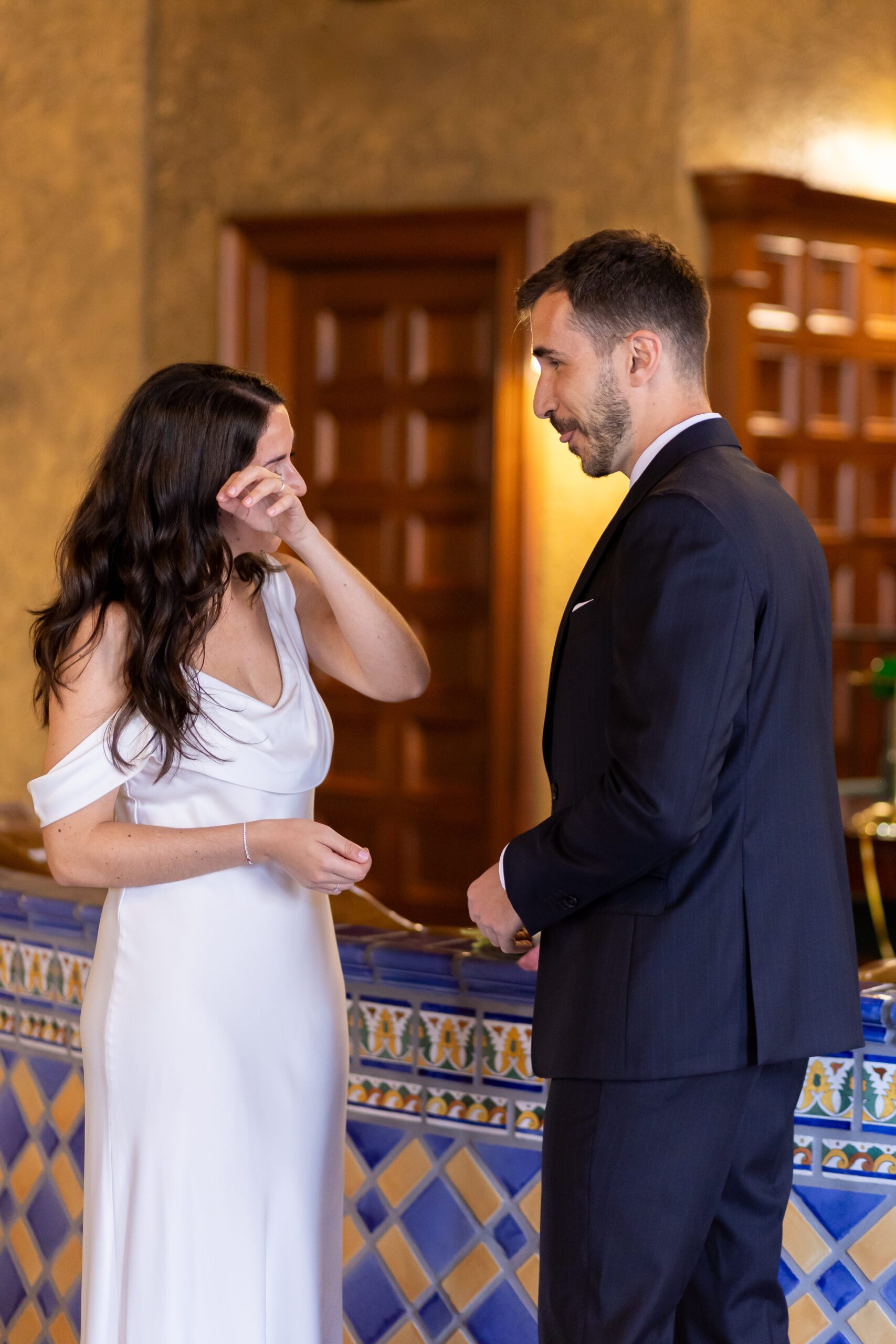 Bride wiping tear during sarasota courthouse elopement ceremony